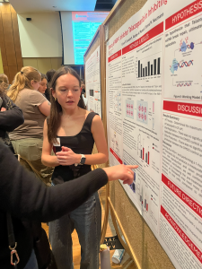 Ellie Davenport at poster symposium